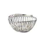 A fine George III silver bread basket by IT, having pierced sides and swing handle, London 1809,