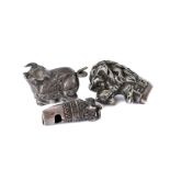 Three interesting silver and white metal objets d'art, including a leopards head dog whistle