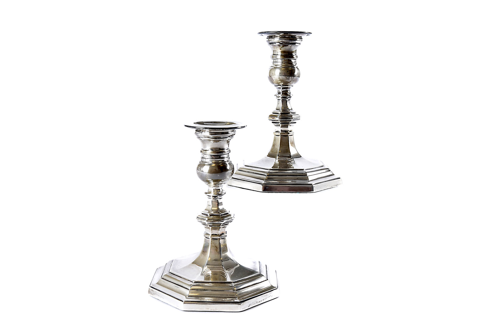 A pair of George V silver filled candleholders from Mappin & Webb, octagonal bases and knops to