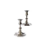 A pair of George V silver filled candleholders from Mappin & Webb, octagonal bases and knops to