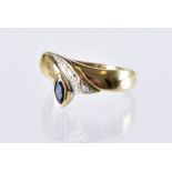 A continental gold and sapphire dress ring, sweeping tablet set with a navette shaped blue stone and