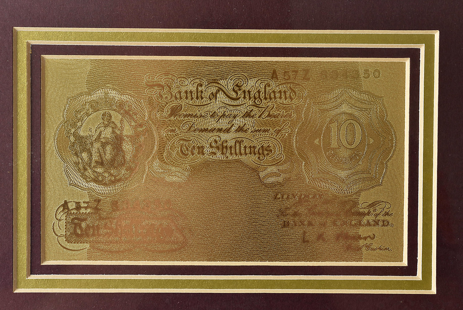 A Royal Mint Bank of England Ten Shillings and Five Pound gold bank note set in frame, with - Image 2 of 3