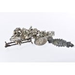 A vintage silver charm bracelet, together with a fox mask and riding crop silver brooch, lacks pin