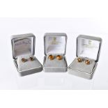 Three pairs of modern earrings, including one pair of 9ct gold knot examples, a pair of 9ct gold and