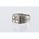 A vintage diamond dress ring, the white metal mount marked 18K having a tablet set with four old and