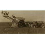 Aviation, a photograph of a crashed "Caproni" biplane I-EXLA, with car and surrounding crowd of