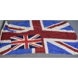 A large silk Union flag, approx 260cm by 130cm, together with an early nylon smaller example, approx