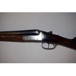 A Spanish Master 12 bore double barrel shotgun, break loading, having mahogany stock and body with