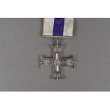 A Military Cross medal, the unnamed medal on white and purple striped ribbon