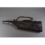 A vintage Leg O Mutton gun case, in brown leather with original strap