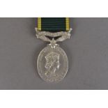 An Elizabeth II Efficiency medal with Territorial bar, awarded to 1447394 SGT.J.L.SYMINGTON.R.A,