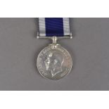 A Royal Naval Long Service and Good Conduct medal, with George V coinage profile, awarded to