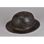 A 18th century leather brodie style helmet, the thick one piece leather helmet, in the shape of a