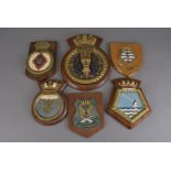 A collection of wooden military plaques, including Daedalus, 2 x Fort Austin, Tidespring,