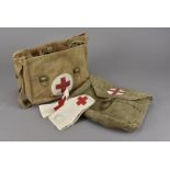 A collection of military Red Cross items, including arm bands, circa WWII, a complete med kit bag,