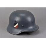 A German Army M35 single decal helmet, the grey painted helmet with the National Colour decal to one