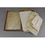 A WWII document holder, containing various documents, including a map, training documents,