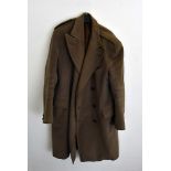 A collection of military formal wear and vintage clothing, including a greatcoat, a green waterproof