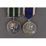 A George VI Royal Naval Reserve Long Service and Good Conduct medal, awarded to 3149 U. T.F.HOWIE.