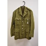 A British olive green battledress, having Crowned RLR button and tank cloth badge to the sleeve,