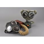 A WWII British issue No.4 Mk III gas mask, by J.B 12/39, together with another with a khaki cover,