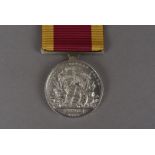 A Victorian China War medal 1840-42, awarded to GEORGE F LUKE MILNER HMS APOLLO, on crimson and deep