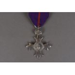 A Member of the Most Excellent Order of the British Empire medal, (MBE), the silver marked breast