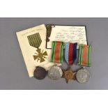 A collection of WWII medals, comprising two Defence medals, a 1939-45 Star, plus a miniature Croix