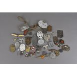A large collection of Third Reich badges, including the Narvik 1940 shield, 1914/42 Crimea shield,