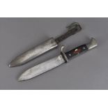 A WWII Third Reich Hitler Youth dagger, by RZM, marked M7/40, having enamel swastika in red ad white