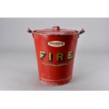 A John Morris & Sons Ltd metal fire bucket and lid, with swing handle and painted red with the