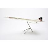Aviation, a scale desk model of Concorde, on a 3 point metal stand, 64cm long x 27cm wing tip to
