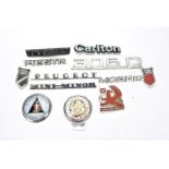 Motoring Badges, a group of car manufacturers name badges including Fiesta, Carlton, Morris, Anglia,