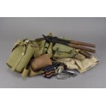 An assortment of British military items, including a pair of WWI wire cutters, a shovel, a selection