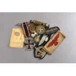 A WWII Third Reich Iron Cross, together with The Metropolitan Patent whistle by J.Hudson & Co, a