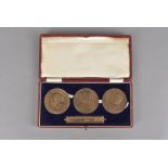 A Three English Kings of 1936 medallion set, the three medallions having profiles of George V and