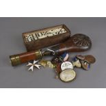 A collection of miscellaneous items, including an Order of St John breast badge, a set of Prisoner