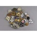 A large collection of buttons and badges, comprising Royal Engineers, Marabout, The Queens