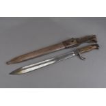 A WWII German saw back bayonet, marked 'WAFFENFABRIK MAUSER A.G OBERNDORE a N, to the blade, with
