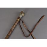 An early 20th Century German swagger stick, having white metal top with multiple plaques,