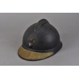 A WWI French Adrian helmet, having brass veteran's visor plate, with inscription 'Solidat de la