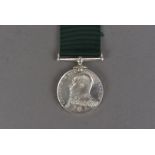 An Edward VII Royal Naval Reserve Long Service and Good Conduct medal, with bear headed bust in