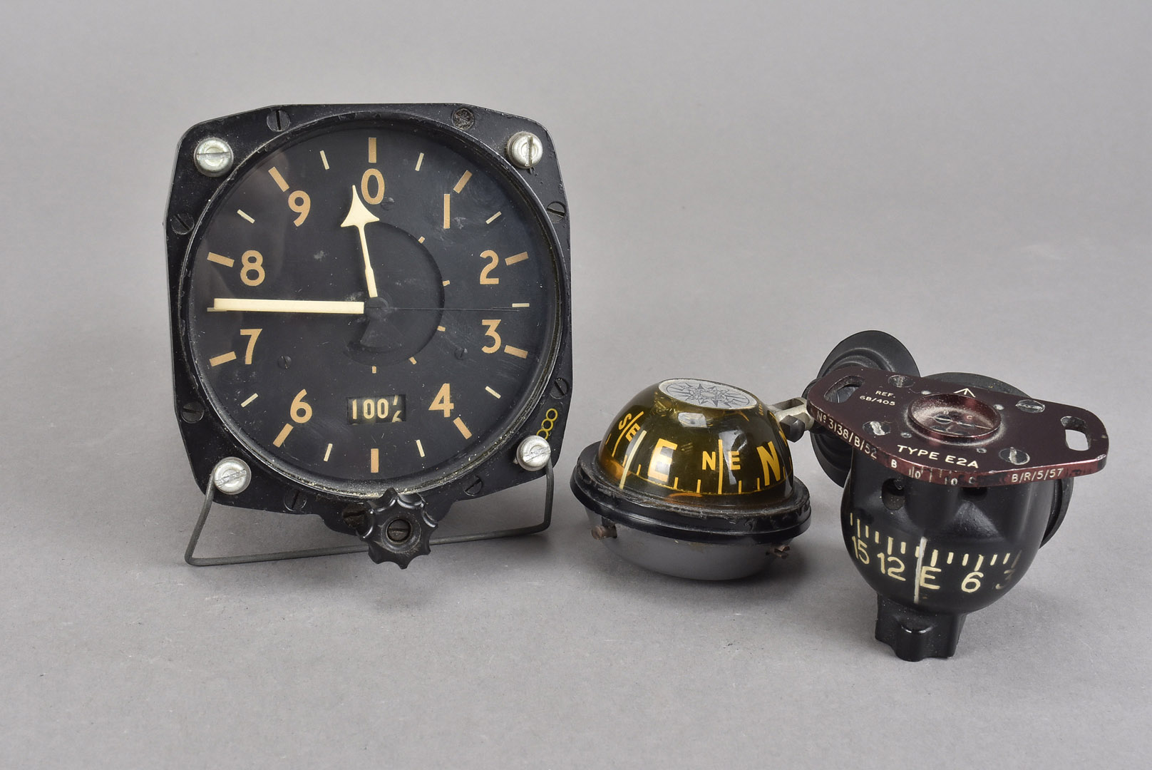 A Military S.Smith & Sons altimeter, together with a Type E2A compass and another, plus a small