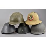 A selection of overseas military helmets, including a Dutch M34 helmet, having coat of arms to the