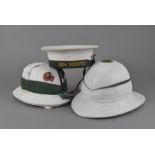 A 20th Century Sea Scouts cap and ribbon, together with a Royal Naval Pith helmet, by Gleves Ltd,