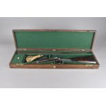 A 19th century Patrick muzzle loading double barrelled shotgun, with percussion cap action,