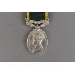 A George VI Efficiency medal with Territorial bar, awarded to 867704 BMBR.J.W.MATTHEWS.R.A, on
