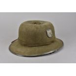 A WWII Third Reich Afrika Korps Pith helmet, in olive green, with German Army metal decal to one