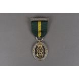 An Edward VII Territorial Decoration, with plain dark green with yellow stripe ribbon on oak leaf