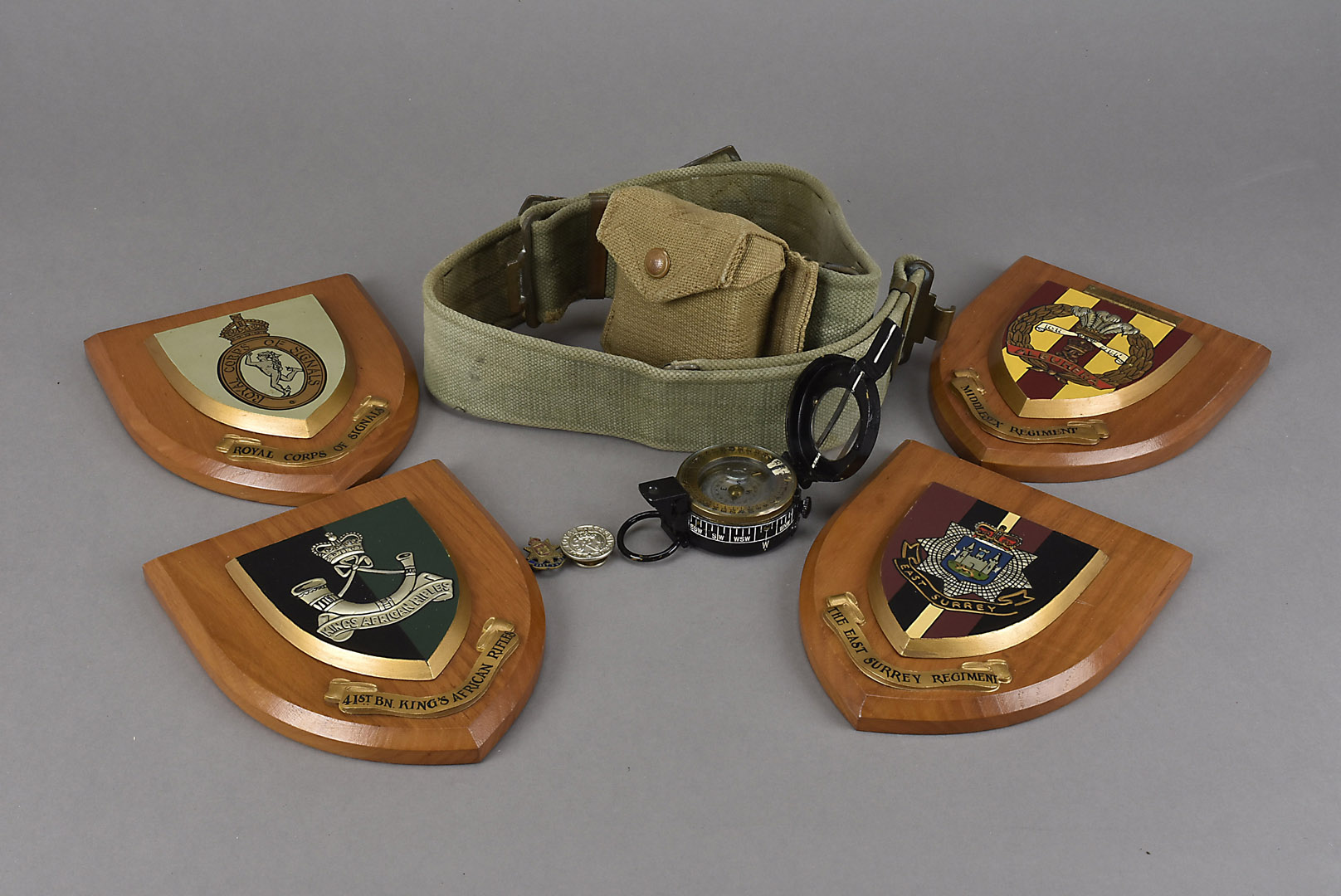 A WWII E.A.C MkIII field compass, no. 131966, with broad arrow, dated 1943, in 1938, pouch and belt,